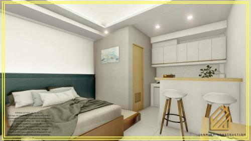 a rendering of a bedroom with a bed and a kitchen at JP Suites & Residences in Tayabas