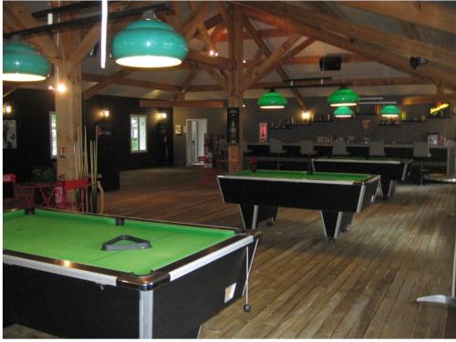 a room with billiard tables in a building at Mammiehome - 6 places - Mimizan - Camping La Lande in Mimizan