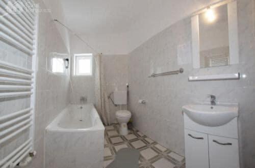 a white bathroom with a sink and a toilet at Weinesya Sun7 in Beliş