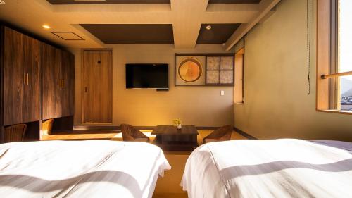 Cama o camas de una habitación en 宵待ちの宿　萩一輪