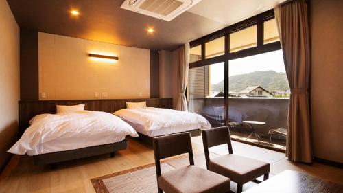 Cama o camas de una habitación en 宵待ちの宿　萩一輪