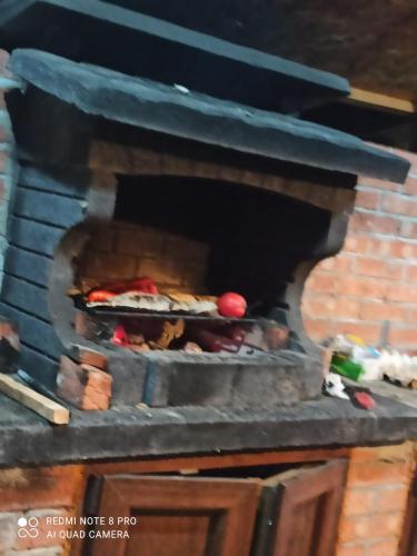 a brick oven with food inside of it at Popasul Dacilor in Predeluţ