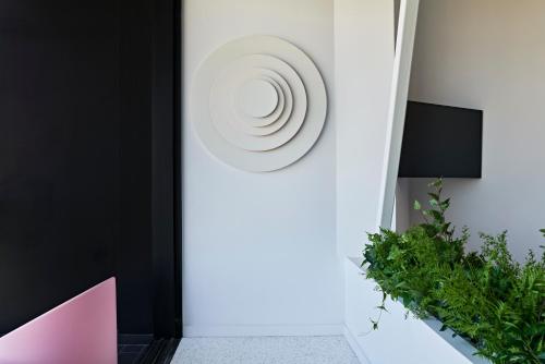 a room with a door with a plate on the wall at MAP Boutique Hotel in Nicosia