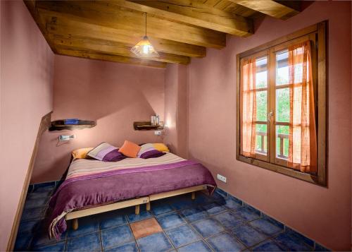 Ένα ή περισσότερα κρεβάτια σε δωμάτιο στο Agroturismo Mari Cruz