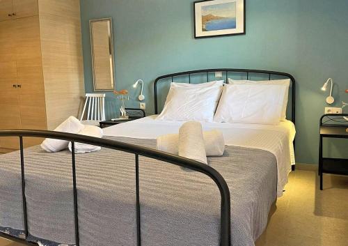 a bedroom with a large bed with white pillows at Varsamos in Yiannioú