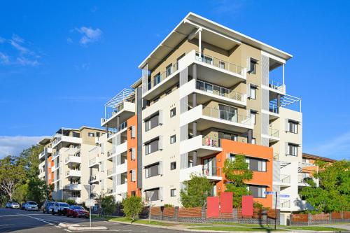 an apartment building on the side of a street at Parramatta New 2Bedroom apt close to TrainShoping in Sydney