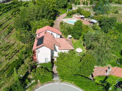 an aerial view of a house with a swimming pool at La Casa di Baba in Masserano