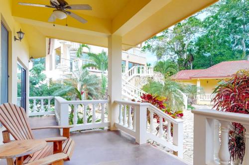 a porch with two chairs and a ceiling fan at Morningstar Breeze Gold Standard Certified in Hopkins