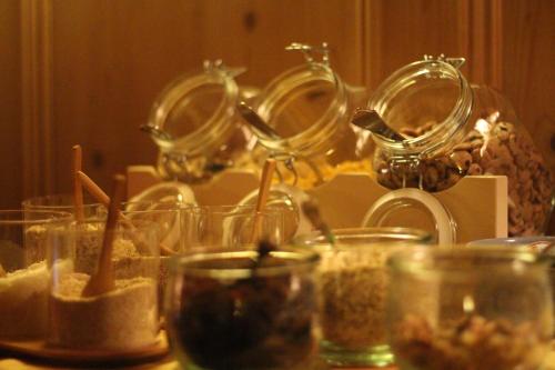 a table topped with glasses filled with food at Gatterhof in Riezlern