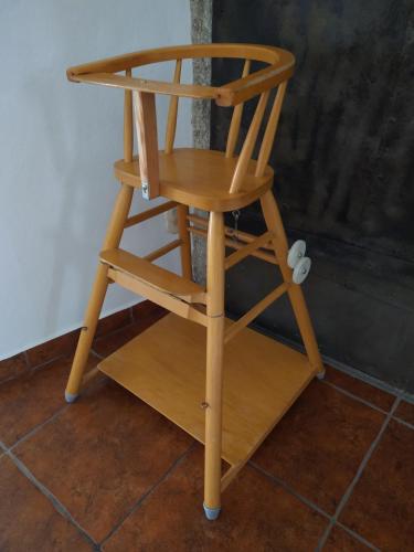 a wooden chair sitting on top of a floor at Apartmán Špuntárna in Polná