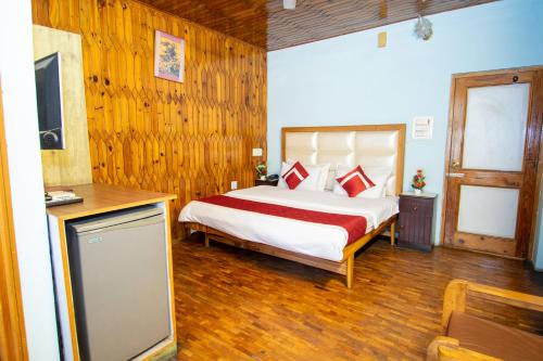 Postel nebo postele na pokoji v ubytování Octave Himalayan Hamlet