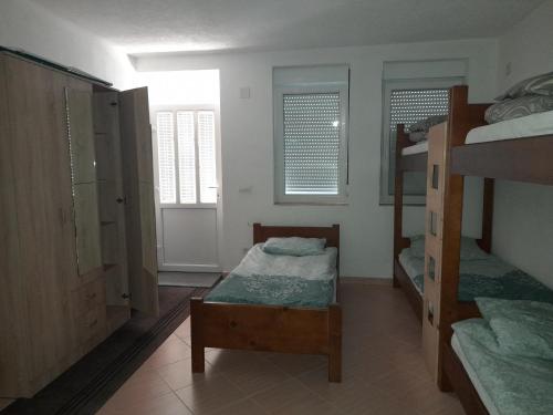 Postel nebo postele na pokoji v ubytování Apartman Osmancevic
