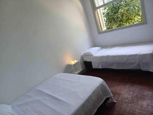 Кровать или кровати в номере Linda Casa para grupo/ 1km da Expo SP /500m metrô