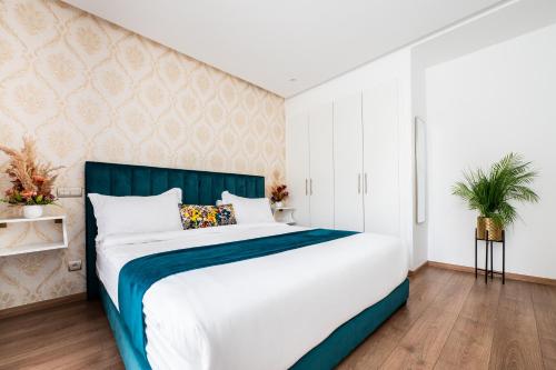 Ένα ή περισσότερα κρεβάτια σε δωμάτιο στο Family Aparthotel