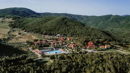 an aerial view of a resort in the mountains at Borgo San Pecoraio Resort in Riparbella