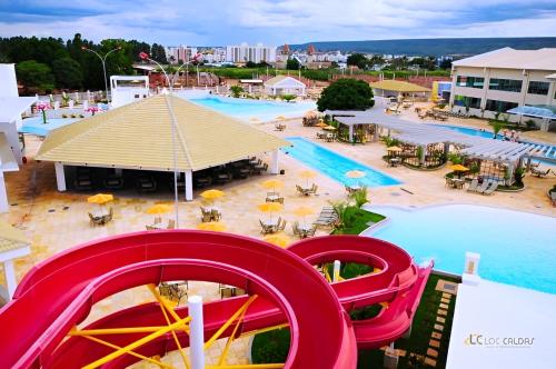 an aerial view of a resort with a water slide at Lacqua diRoma com Parque Aquático e Cozinha in Caldas Novas