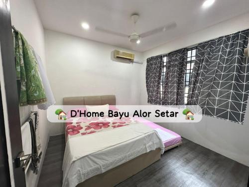 a small bedroom with a bed and a window at Dhome Bayu Alor Setar in Alor Setar