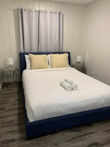 a large bed with two towels on top of it at Muskoka Waterfront Retreat in Dwight