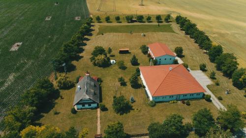 an aerial view of a large house with a red roof at Enjoy the quiet nature in our unique cottage 