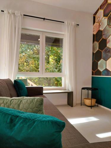 a living room with a couch and a window at Beim Bergjosl in Kirchbach in Steiermark