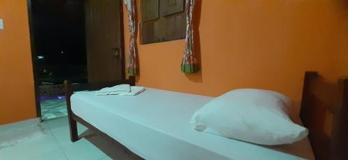 Postel nebo postele na pokoji v ubytování ROSÁRIO TEMPORADA Hostel