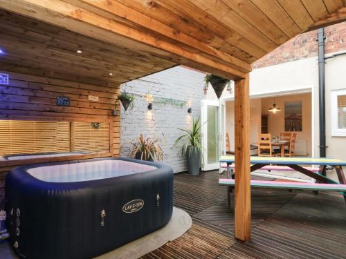 a patio with a pool table and a ping pong table at 10 Walton Terrace in Guisborough