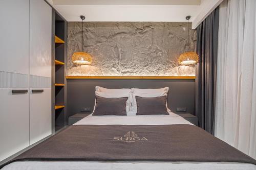 Postel nebo postele na pokoji v ubytování Surga Alaçatı