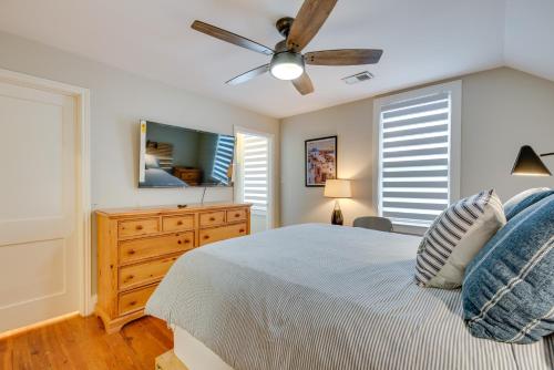 a bedroom with a bed and a ceiling fan at Welcoming Norcross Cottage with Deck and Shared Grill! in Norcross