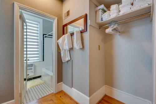 a bathroom with a walk in shower and a toilet at Cozy and Modern Norcross Hideaway with Covered Porches in Norcross