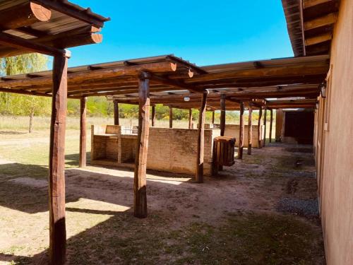 a wooden pergola on the side of a building at Terrazas de Lobos in Lobos