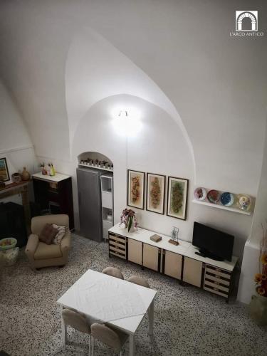 a living room with a couch and a table at Arco Antico in Grassano