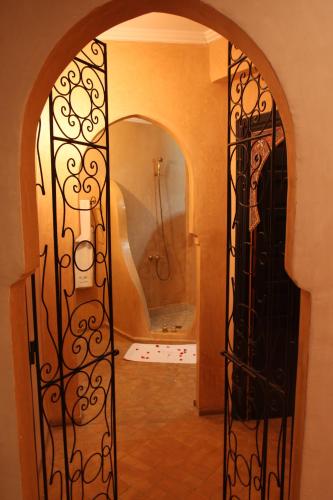 an open door to a bathroom with a shower at VILLA CATHERINE MARRAKECH in Marrakech