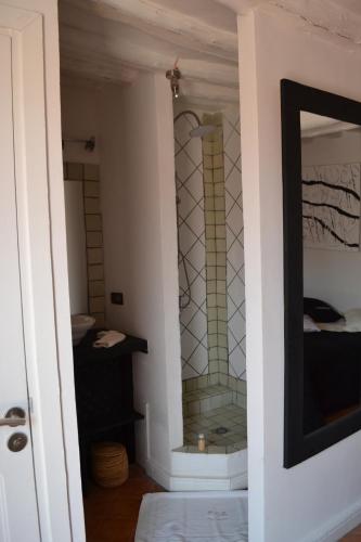 a bathroom with a glass shower in a room at VILLA CATHERINE MARRAKECH in Marrakech
