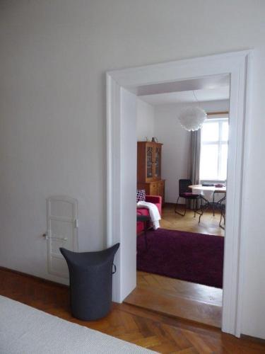 a room with a bedroom with a bed and a table at Alte Villa in Pähl