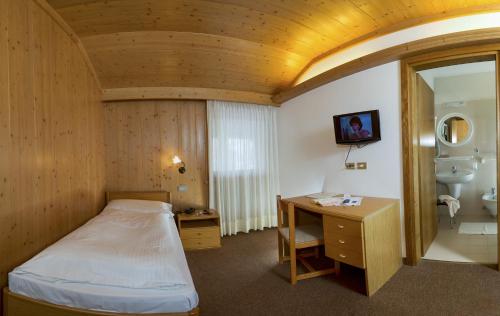 Postel nebo postele na pokoji v ubytování Hotel Gran Mugon