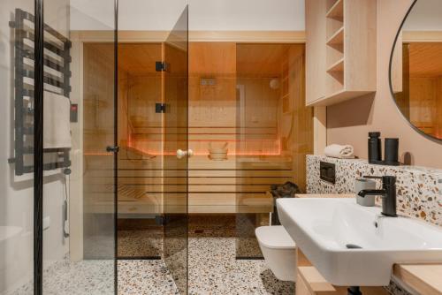 a bathroom with a shower and a sink and a toilet at Siema Siemiany in Siemiany