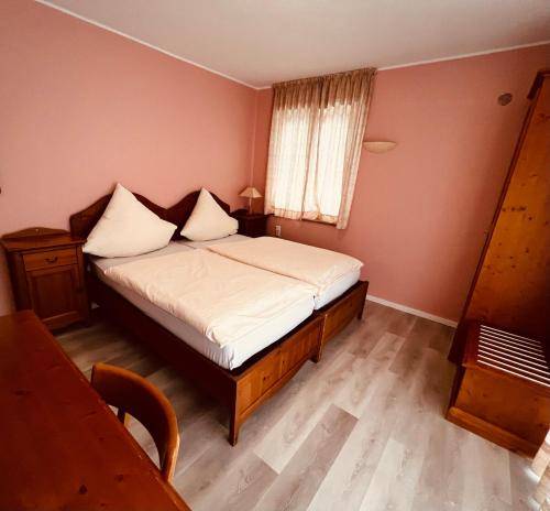 Ένα ή περισσότερα κρεβάτια σε δωμάτιο στο Osteria-Hotel-Centovini