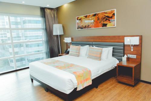 Letto o letti in una camera di Ubumwe Grande Hotel