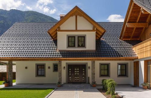 a house with a brown roof at PRIVILLAGE Stare - Villa & Chalet in Bohinj