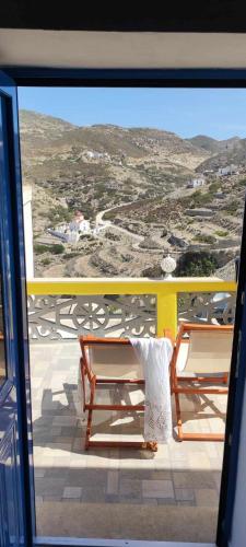 a balcony with two benches and a view of a mountain at Olympos Princess in Olympos