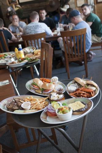 a table with plates of food on it at Mountain Harbor Queen Guest Room on Lake Ouachita in Mount Ida
