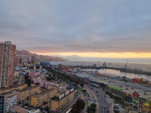 an aerial view of a city with the ocean at Antofagasta Inolvidable-SOLO ADULTOS in Antofagasta