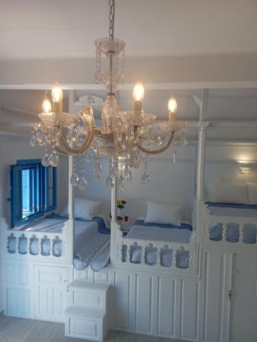 a chandelier in a room with two bunk beds at Olympos Princess in Olympos