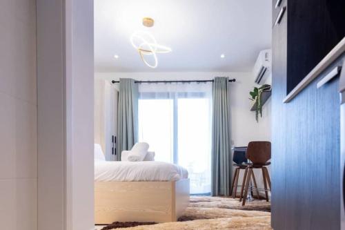 a bedroom with a bed and a window at Airport Residential Suite in Accra