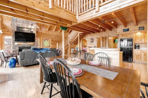 a dining room and kitchen with a table and chairs at The Laughing Salamander in Dupont Springs