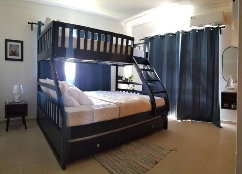 Letto o letti in una camera di Lovely condo at Blue Sea Tower near Juan Dolio beach