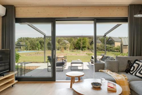 a living room with a large sliding glass door at Siema Siemiany in Siemiany