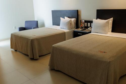 Ένα ή περισσότερα κρεβάτια σε δωμάτιο στο Diverxo Hotel & Villas