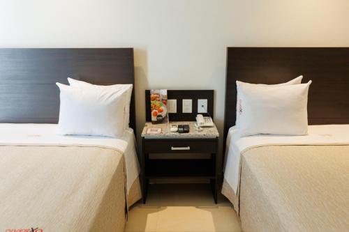 Ένα ή περισσότερα κρεβάτια σε δωμάτιο στο Diverxo Hotel & Villas