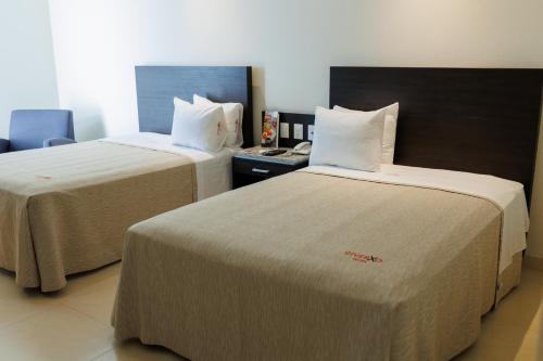 Ένα ή περισσότερα κρεβάτια σε δωμάτιο στο Diverxo Hotel & Villas